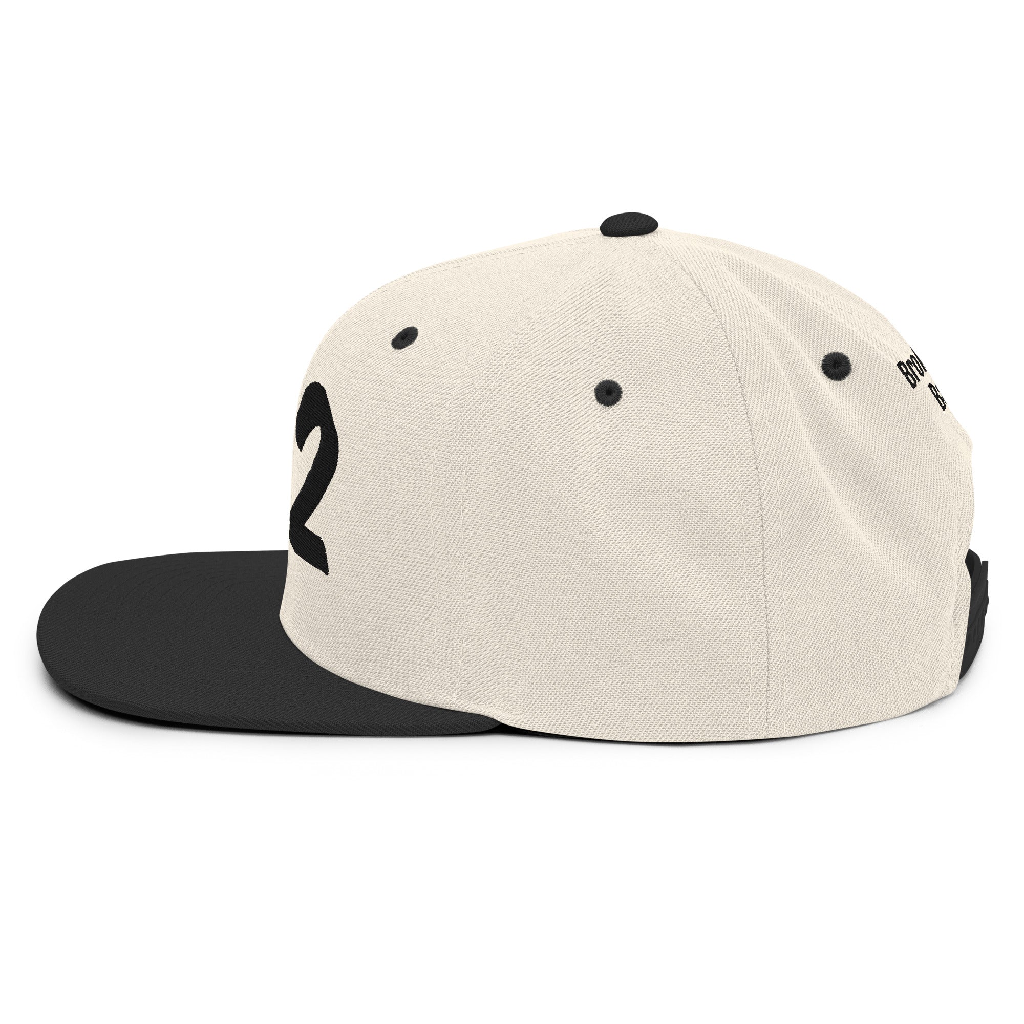 222 Angel Numbers Snapback Hat side view showing cream and black color scheme and structured design