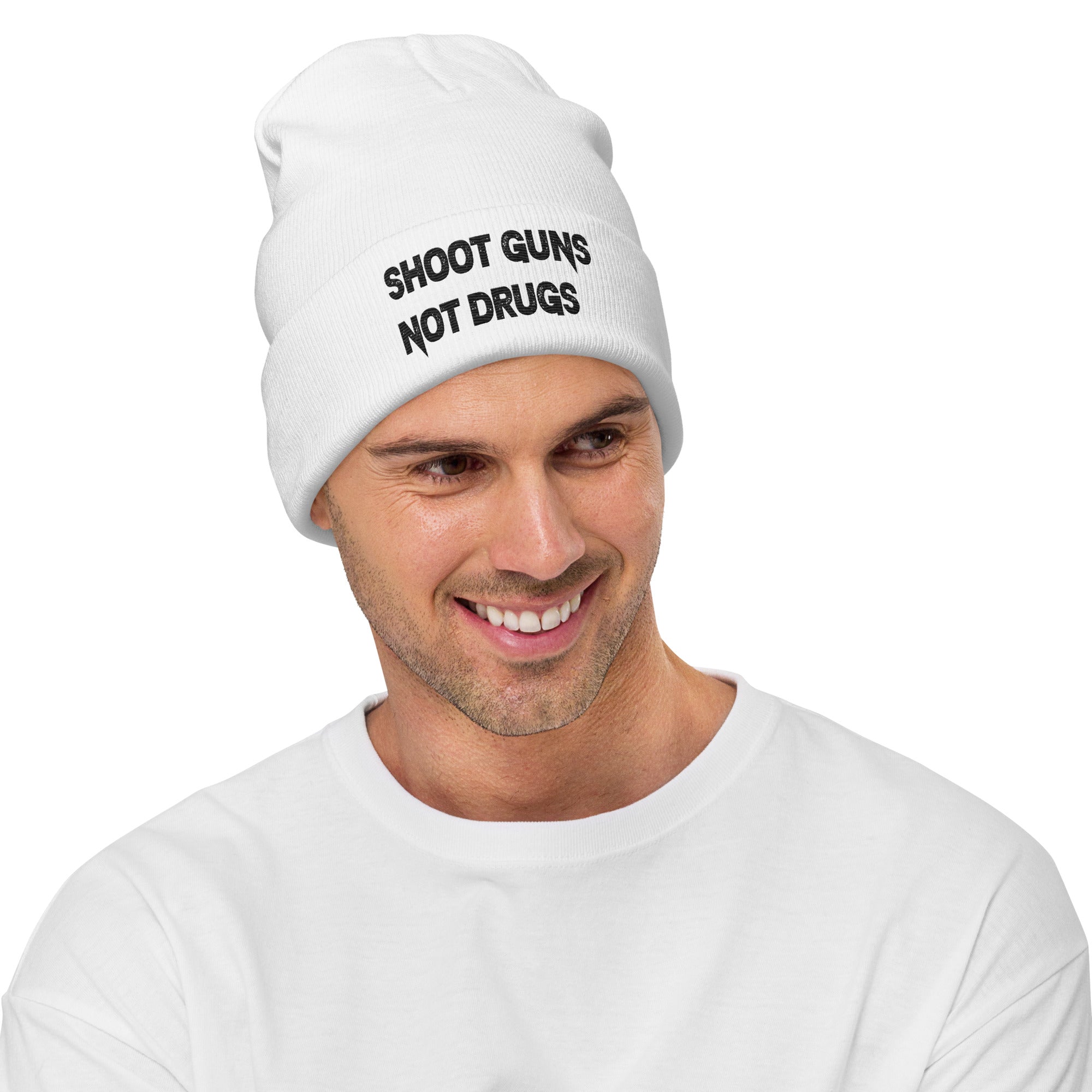 Shoot Guns Not Drugs No Gun - Embroidered Cuffed Beanie worn by a smiling man in a white shirt.