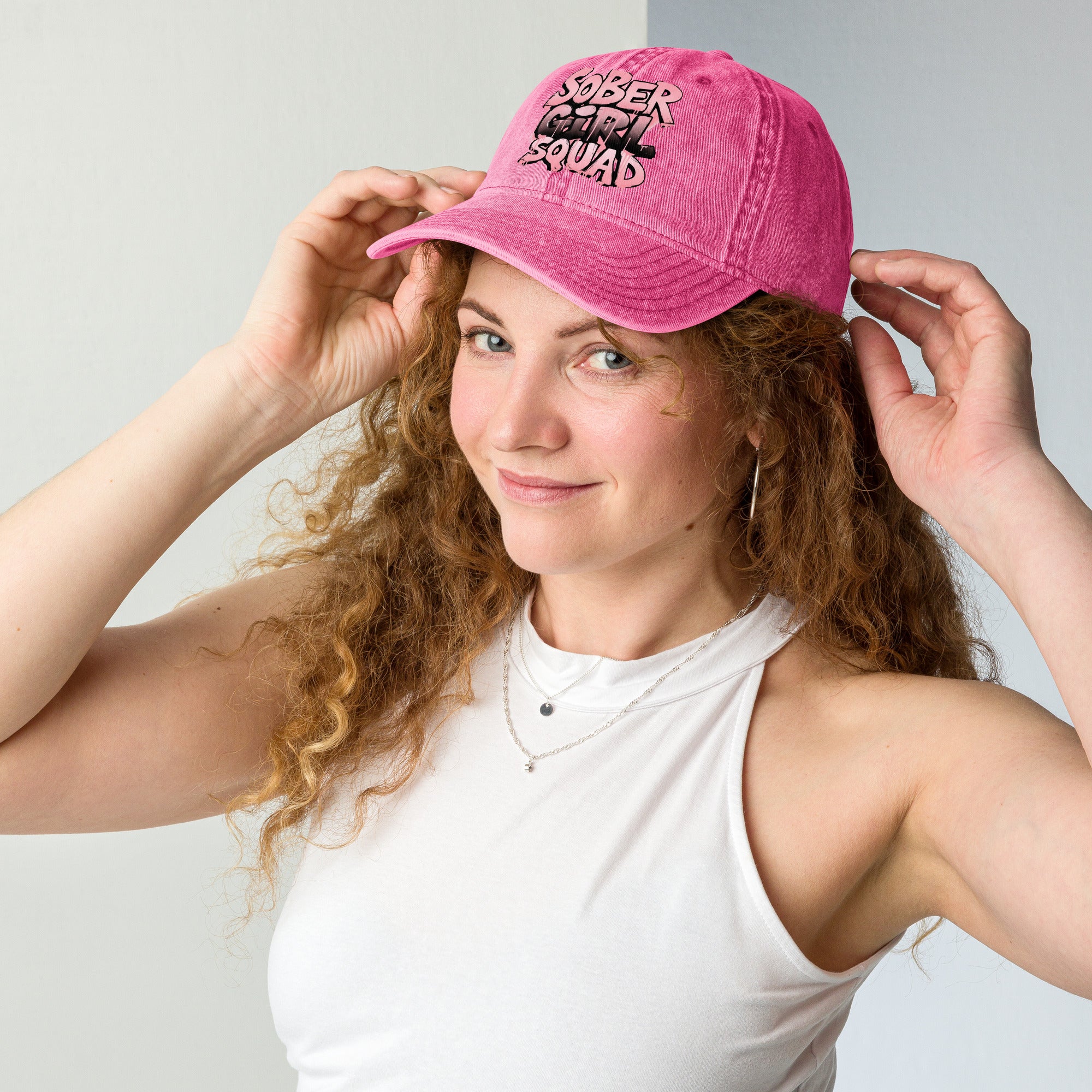 Sober Girl Squad - Vintage Cotton Twill Cap in pink on a woman with curly hair, showcasing its stylish design.